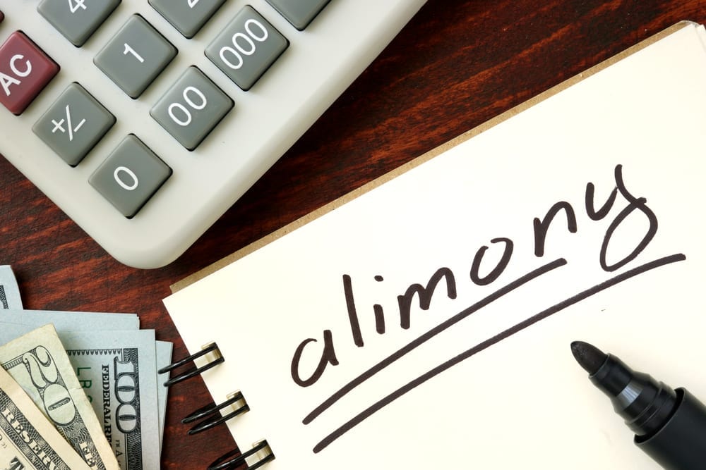 alimony lawyer - money and calculator on desk